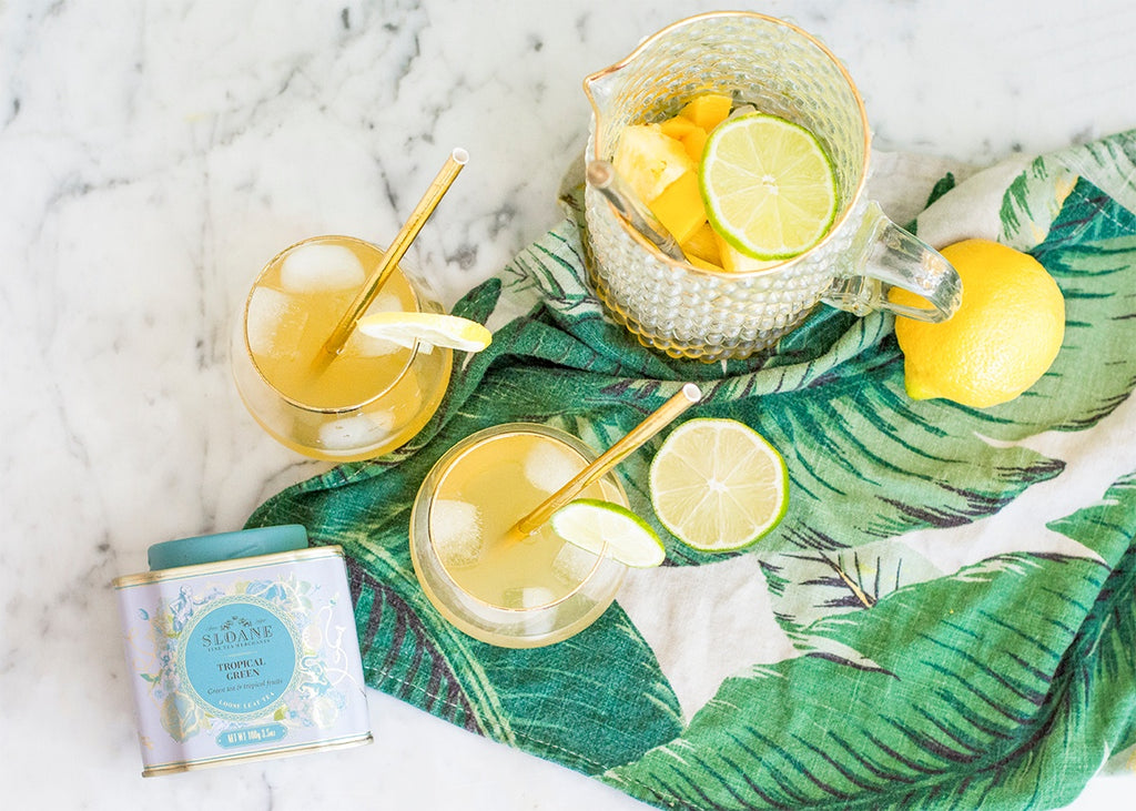 Tropical Green iced tea sangria in glasses and pitcher